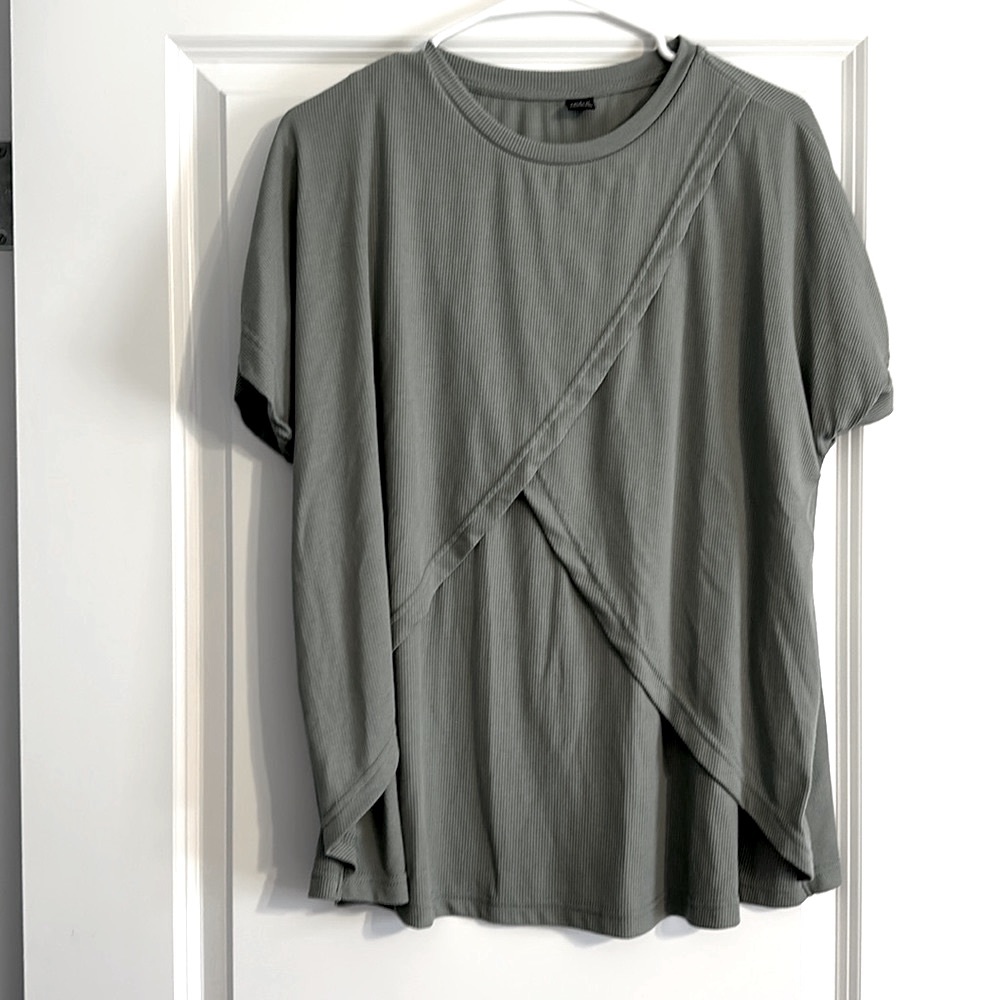 Never worn women’s nursing short sleeve shirt. Opens on either side under flaps.
